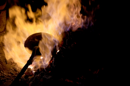 forge fire in blacksmith's where iron tools are craftedの写真素材