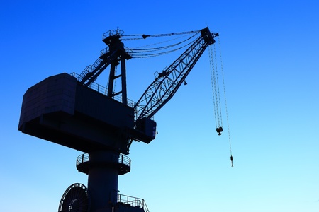 Cranes in dockyard  at sunsetの写真素材