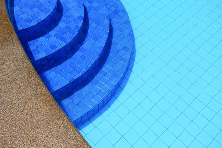 Swimming pool in curved shape with stairsの写真素材