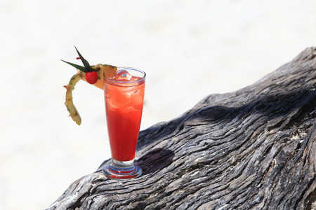 fruit cocktail on a tropical island beachの写真素材