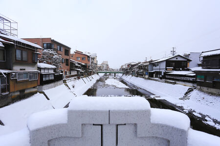 Miyagawa River Surrounded with Snow(Takayama, Japan)の写真素材
