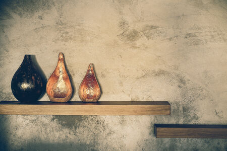 wooden shelf and wall with shadows with retro filter effectの写真素材