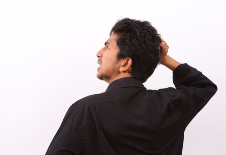 businessman angry and shouting over isolated white backgroundの写真素材