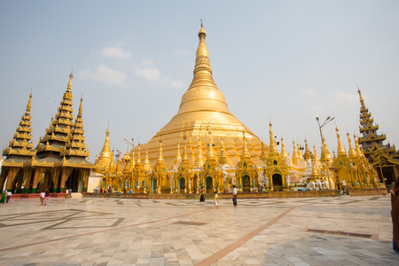 YANGON, BURMA - April 6  Unidentified temple-goers visit Shwedagon Paya on April 6, 2014 in Yangon, Burma  Built between 6th and 10th century Shwedagon is considered Burmaのeditorial素材