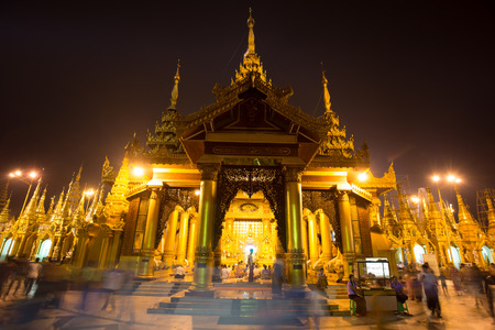 YANGON, BURMA - April 6  Unidentified temple-goers visit Shwedagon Paya on April 6, 2014 in Yangon, Burma  Built between 6th and 10th century Shwedagon is considered Burmaのeditorial素材