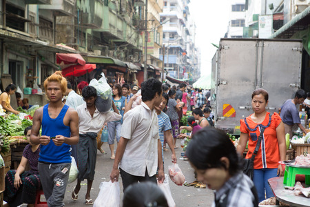 Yangon, Myanmar - April 6, 2014: Trading activities at the downtown Yangon market. This is a local market in the village of  Yangon where people come from all over the area to sell their fruits, vegetables, grogeries, etc.のeditorial素材