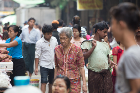 Yangon, Myanmar - April 6, 2014: Trading activities at the downtown Yangon market. This is a local market in the village of  Yangon where people come from all over the area to sell their fruits, vegetables, grogeries, etc.のeditorial素材