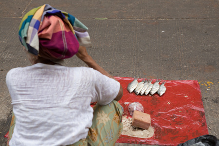Yangon, Myanmar - April 6, 2014: Trading activities at the downtown Yangon market. This is a local market in the village of  Yangon where people come from all over the area to sell their fruits, vegetables, grogeries, etc.のeditorial素材