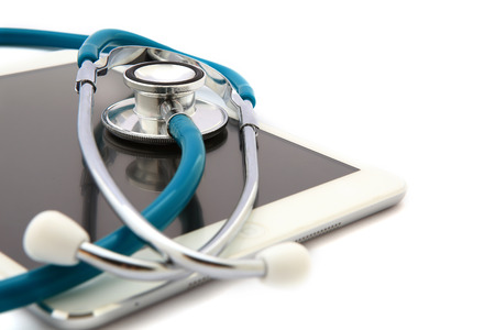 Tablet Computer With Stethoscope, Isolated On White Backgroundの写真素材