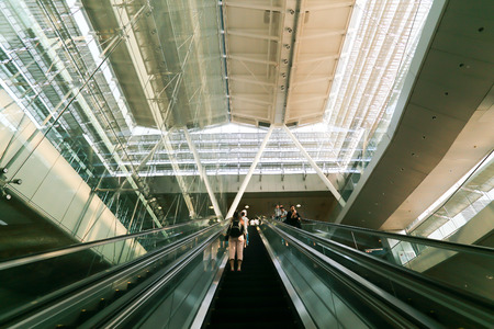 SINGAPORE - MAY 13 : Escalators at Changi International Airport on May 13, 2014 in Singapore. Changi Airport serves more than 100 airlines operating 6,100 weekly flightsのeditorial素材