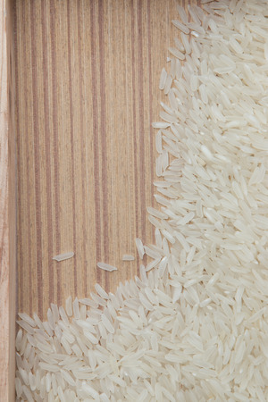 rice grain and wooden background textureの写真素材