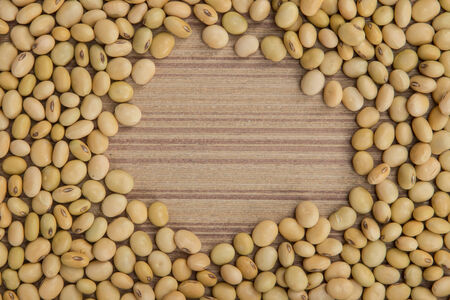 Dry soybeans on wooden board