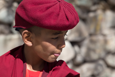LADHAK, INDIA - September 14: Picture of an unidentified boy taken on 14 September 2014 at Ladak, where one can see young monks learn rituals to become lamas.のeditorial素材