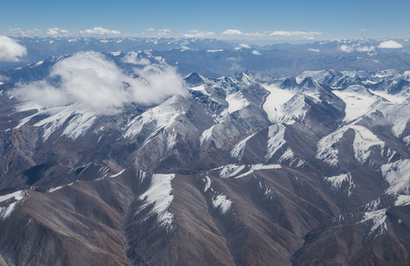 Himalaya mountains under clouds. View from the airplane. India, Ladakhの写真素材