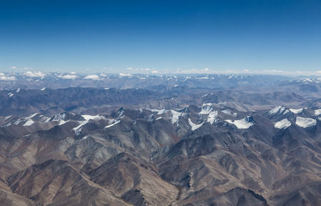 Himalaya mountains under clouds. View from the airplane. India, Ladakhの写真素材