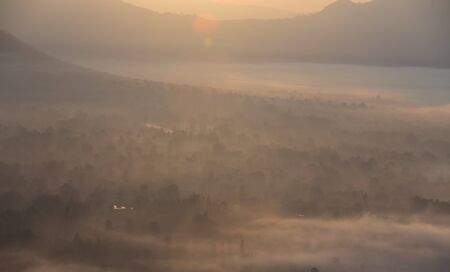 fog and cloud mountain valley sunrise landscapeの写真素材