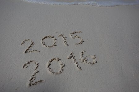 hearts drawn on the sand of a beachの写真素材