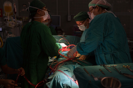 BANGKOK,Thailand-march:31, 2015:The doctor and staff are treating with open heart cardiac bypass surgery in full operation roomのeditorial素材