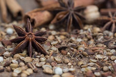 Spices lying on a wooden surface closeupの写真素材