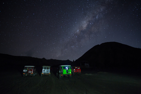 BROMO, INDONESIA - oct 12: Unidentified 4x4 Jeep for rent among the Milky way over the bromo volcano on october 12,2015 in Java, Indonesia. Mount Bromo is one of the most visited tourist attractionsのeditorial素材