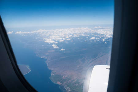 Bali island in tropical sea, veiw from airplane sightの写真素材