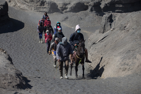 BROMO JAVA,INDONESIA - OCT 13,2015 : Horse riding service around Bromo
Tengger Semeru National Park, East Java, Indonesia.のeditorial素材