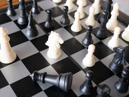 Chess board game with focus on black and white