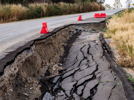 Cracked surface of an asphalt roadの写真素材