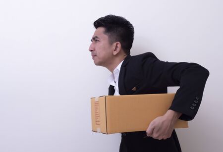 Shop assistant brings the parcel, isolated, white backgroundの写真素材