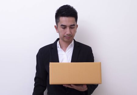 Shop assistant brings the parcel, isolated, white backgroundの写真素材