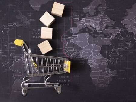 White wooden cube and white basket on the black mapの写真素材