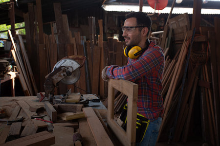 Carpenter worker in carpentry workshop