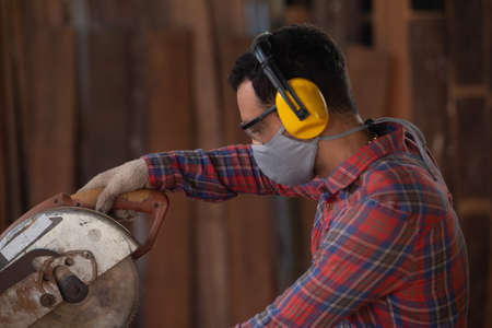 Portrait of professional male carpenter in workshop