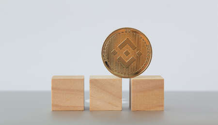 Golden dogecoin coin. Cryptocurrency dogecoin. Doge cryptocurrency on grey background