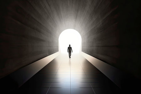 Business success and life in motion concept with man walking towards the light from wall hole in the middle of a huge dark hall with stairs.Generate Aiの素材