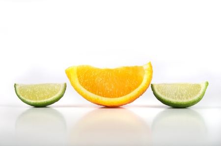 fresh cut orange and lime slicesの写真素材