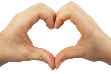 Hands in the shape of a heart made by female male partnersの写真素材