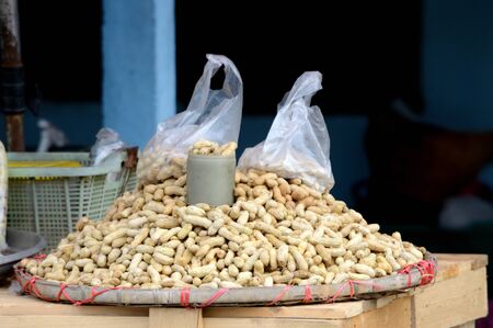 Peanuts on the basket at the marketの写真素材