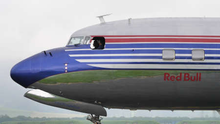 Zeltweg, Austria SEPTEMBER, 6, 2019 Pilot of a vintage airliner greets from the window. Douglas DC-6...