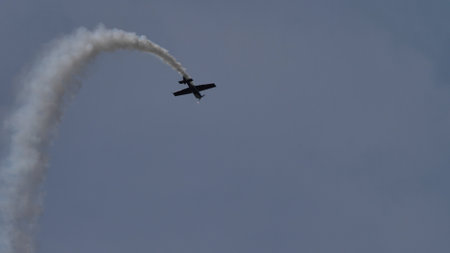 Maribor Airshow Slovenia AUGUST, 15, 2021 Aerobatic plane performs extreme maneuvers during an airshow. MX Aircraft MXS by Veres Zoltanのeditorial素材
