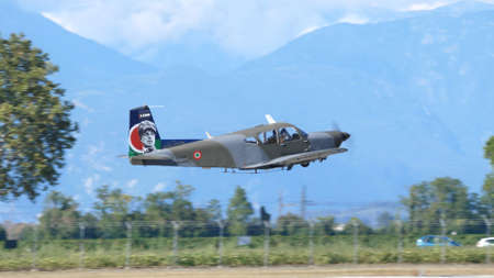 Rivolto , Udine, Italy SEPTEMBER, 17, 2021 Propeller airplane immediately after take-off a few meters from the ground with the landing gear retracted. SIAI Marchetti S.208 of Italian Air Forceのeditorial素材