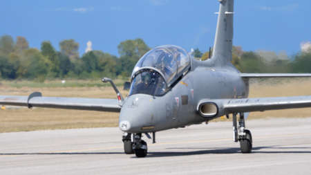 Rivolto del Friuli, Udine, Italy SEPTEMBER, 17, 2021 Frontal view of a grey military two seats in tandem jet trainer airplane. Aermacchi MB-339 of Italian Air Forceのeditorial素材