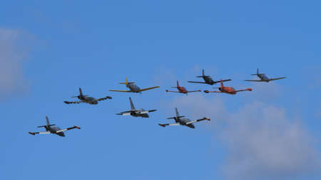 Rivolto Italy SEPTEMBER, 17, 2021 Propellers and jets military trainer airplanes flying together in Formazione Legend, legend formation a huge group of historic vehicles.のeditorial素材