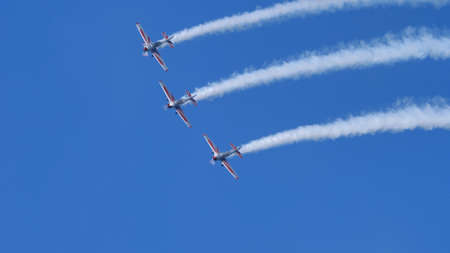 Thiene Italy OCTOBER, 16, 2021 Extreme planes in acrobatic demonstration. Teamwork for results concept. Copy Space. Yakovlev Yak-52 by YAK Italiaのeditorial素材