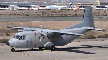 Gando Airport Gran Canaria Spain OCTOBER, 21, 2021 Grey military turboprop cargo aircraft on the...