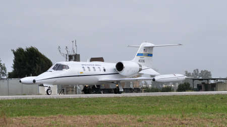 Andravida Greece APRIL, 1, 2022 Modern executive business jet of United Stated air force taxiing on the airport runway. Gates Learjet 35 C-21A of USAF used for passenger and cargo transportationのeditorial素材