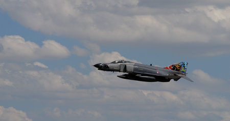 Konya Turkey JUNE, 30, 2022 Vietnam War era combat aircraft in flight in blue sky with white clouds. Copy space. McDonnell Douglas F-4 Phantom II F-4E Terminator 2020 of Turkish Air Forceのeditorial素材