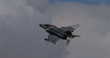 Konya Turkey JUNE, 30, 2022 Fighter jet plane in the cloudy sky. Close up of NATO grey warplane. Copy space. McDonnell Douglas F-4 Phantom II F-4E Terminator 2020 of Turkish Air Forceのeditorial素材