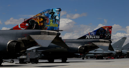 Konya Turkey JUNE, 30, 2022 Turkish flag and NATO logon on parked combat jet airplane tails. Copy space. McDonnell Douglas F-4 Phantom II F-4E Terminator 2020 of Turkish Air Forceのeditorial素材