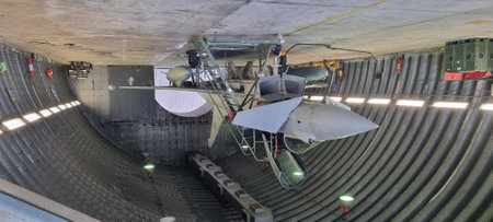 Istrana Italy December 13 2023: A modern NATO Eurofighter Typhoon, armed and stationed in a hangar, prepped for immediate takeoff on alarm. Ideal for editorial use, featuring copy space.のeditorial素材
